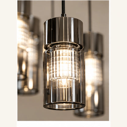 Close-up of smoked cylindrical glass shade and ribbed inner diffuser