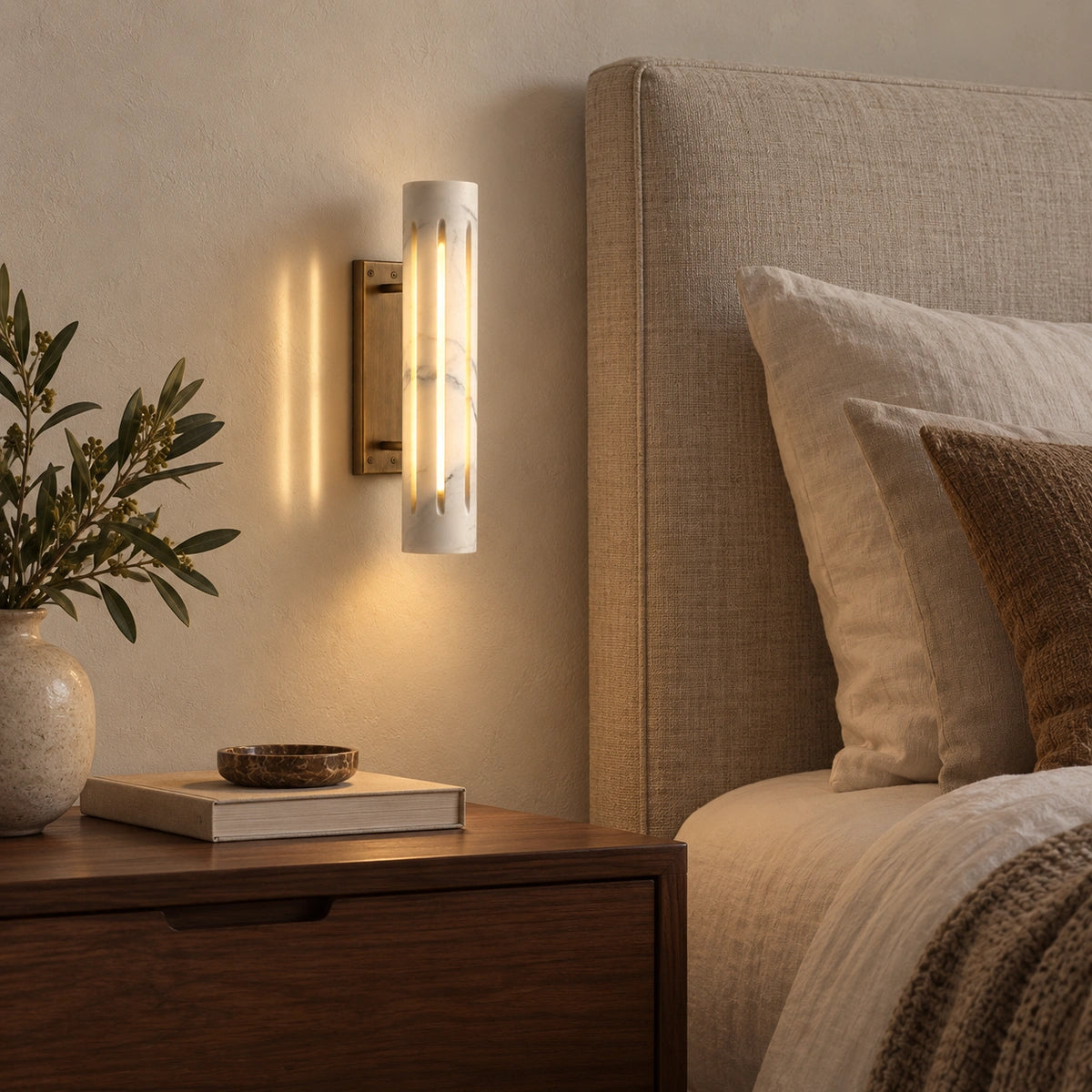 Cylo White marble wall lamp — styled bedroom view with antique brass mount