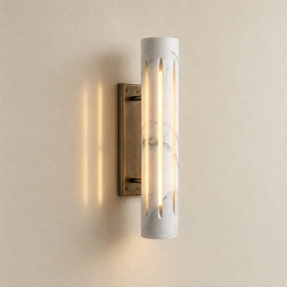 Cylo White marble wall lamp — styled full-product hero with antique brass mount