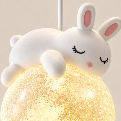 Close-up of the white resin bunny and textured acrylic globe
