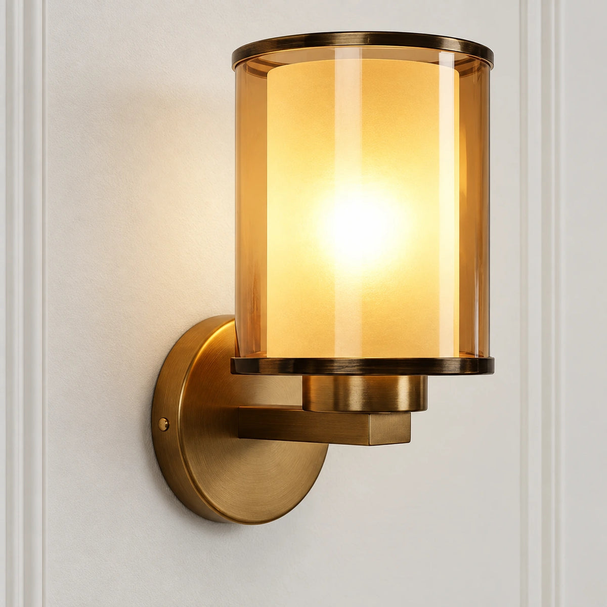 Close-up of cylindrical glass shade, stepped arm and wall plate