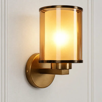 Close-up of cylindrical glass shade, stepped arm and wall plate