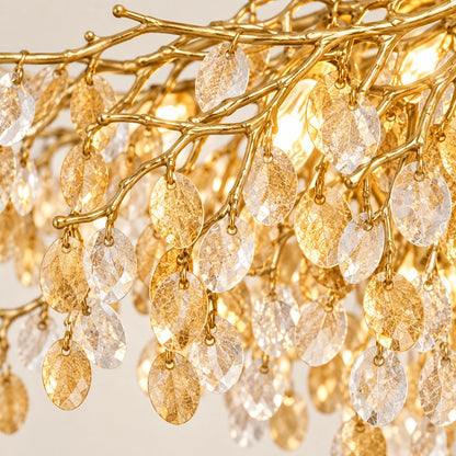 Close-up of clear and amber crystal leaves attached to gold branches