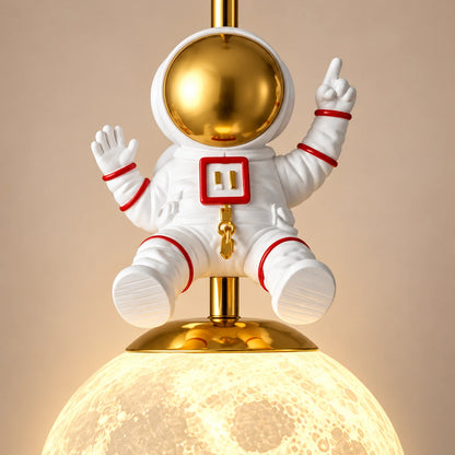 Close-up of the astronaut figure and globe attachment
