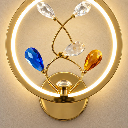 Close-up of the gold mount, illuminated ring and faceted botanical accents