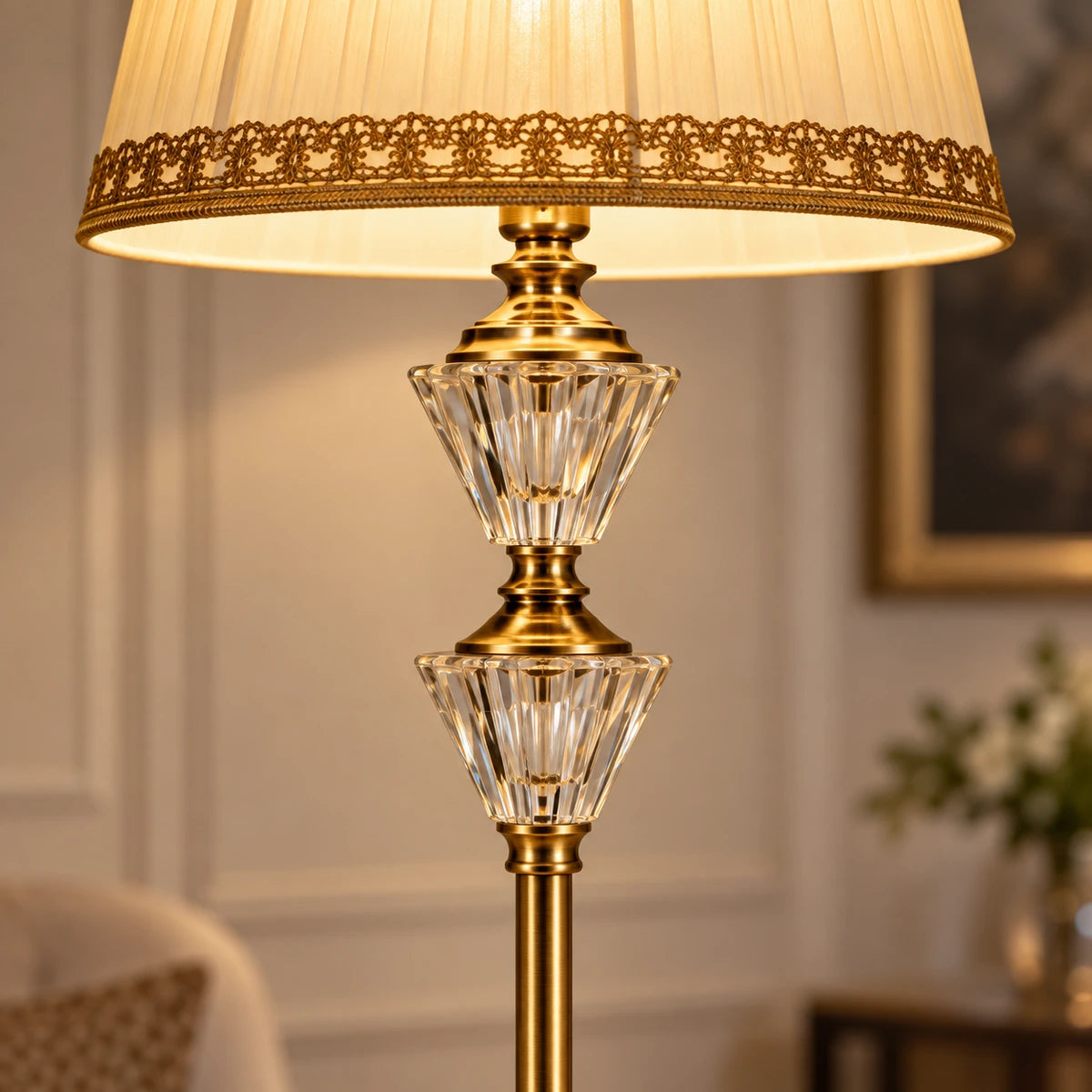 Close-up of the lace-trimmed fabric shade and twin crystal accents