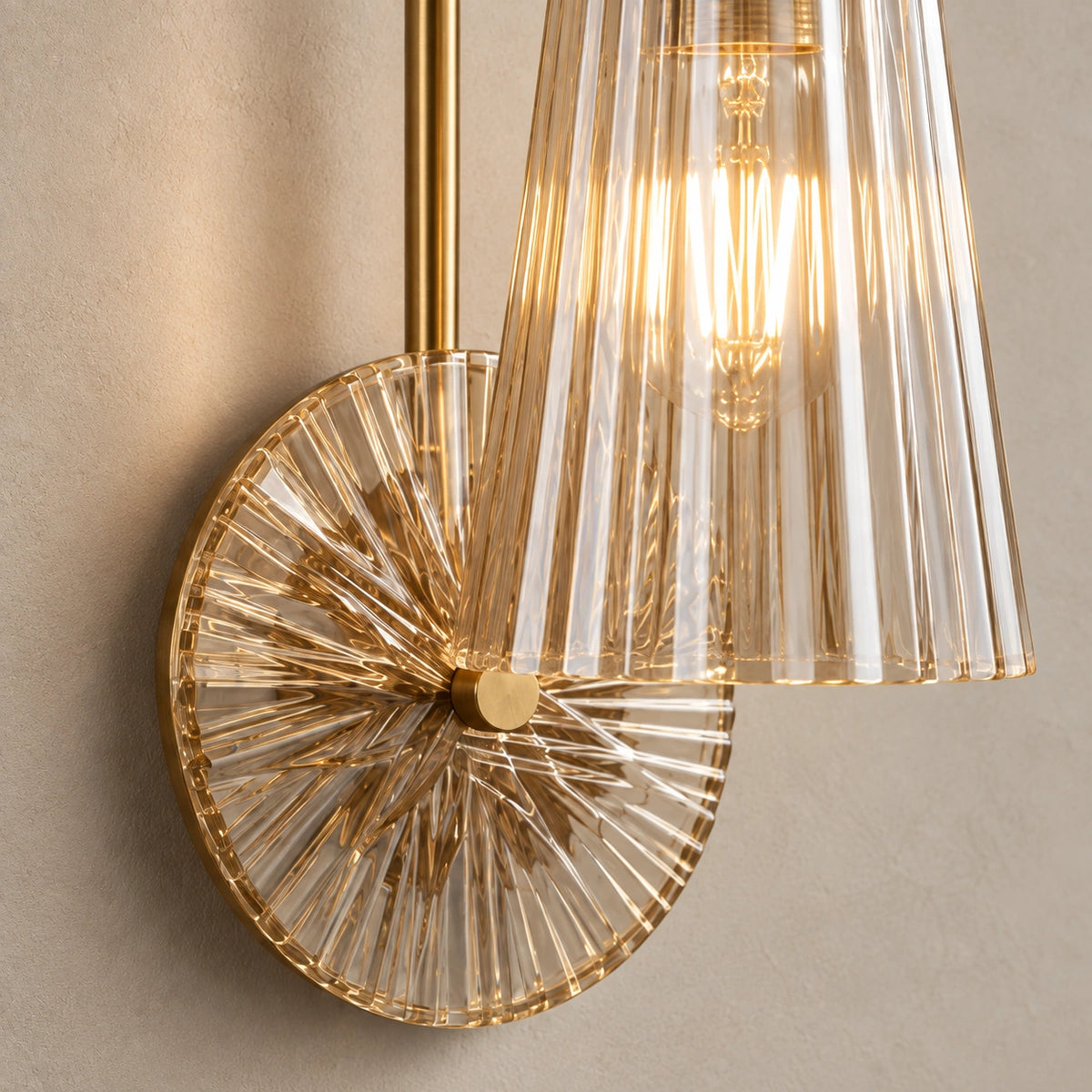 Close-up of the fluted glass shade, radial backplate and central brass-tone fixing