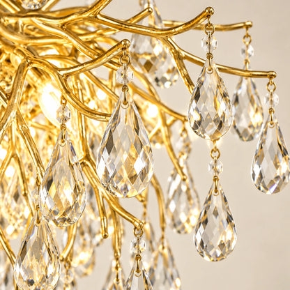 Close-up of clear teardrop crystals attached to gold branches