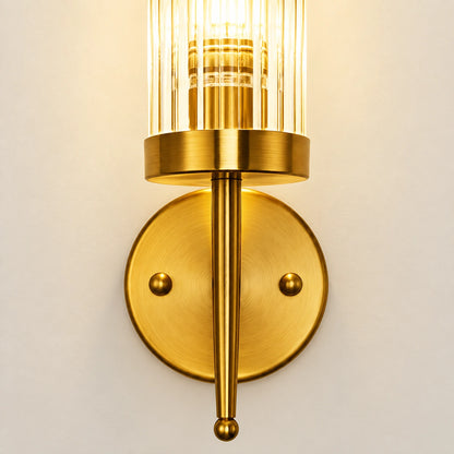 Close-up of the ribbed glass cylinder, brass collar, central rod and round wall plate