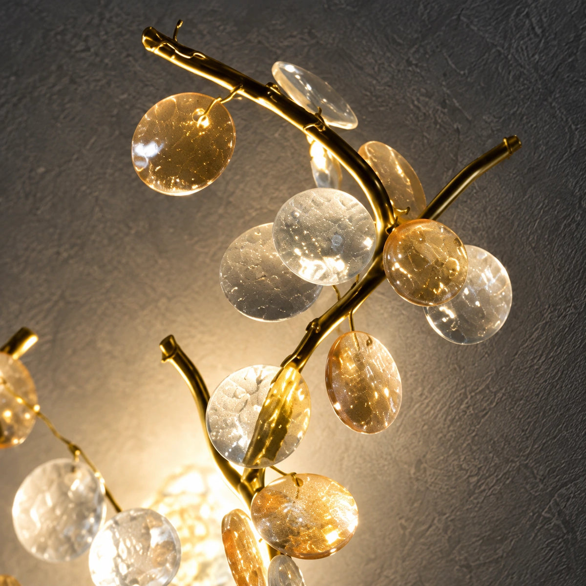 Close-up of translucent clear and amber leaves on warm-gold branches