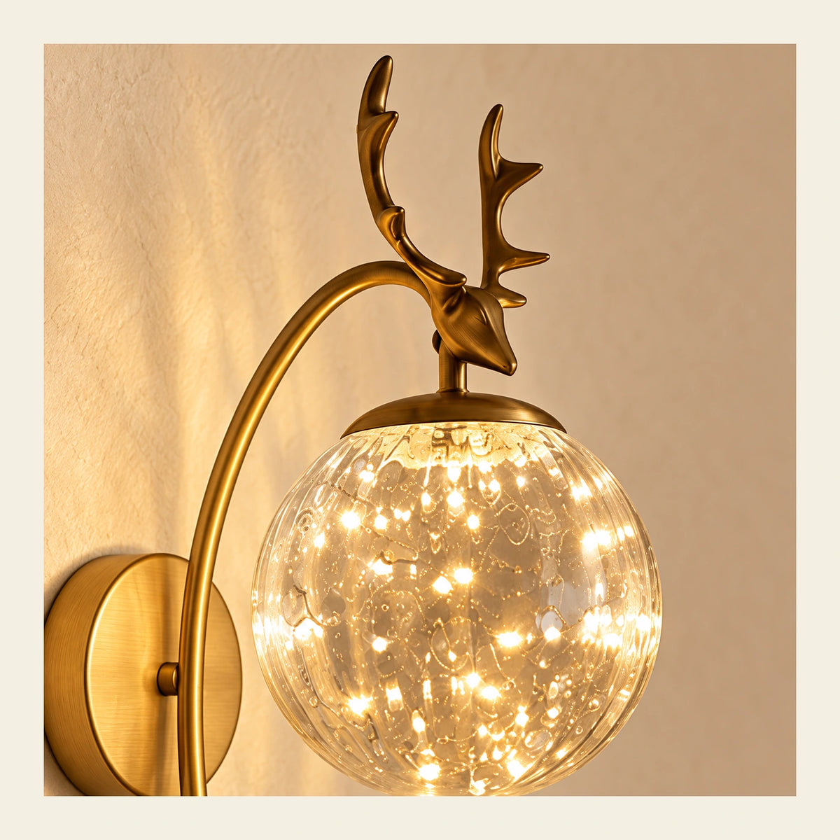 Close-up of bubble glass, globe cap and sculpted antler ornament