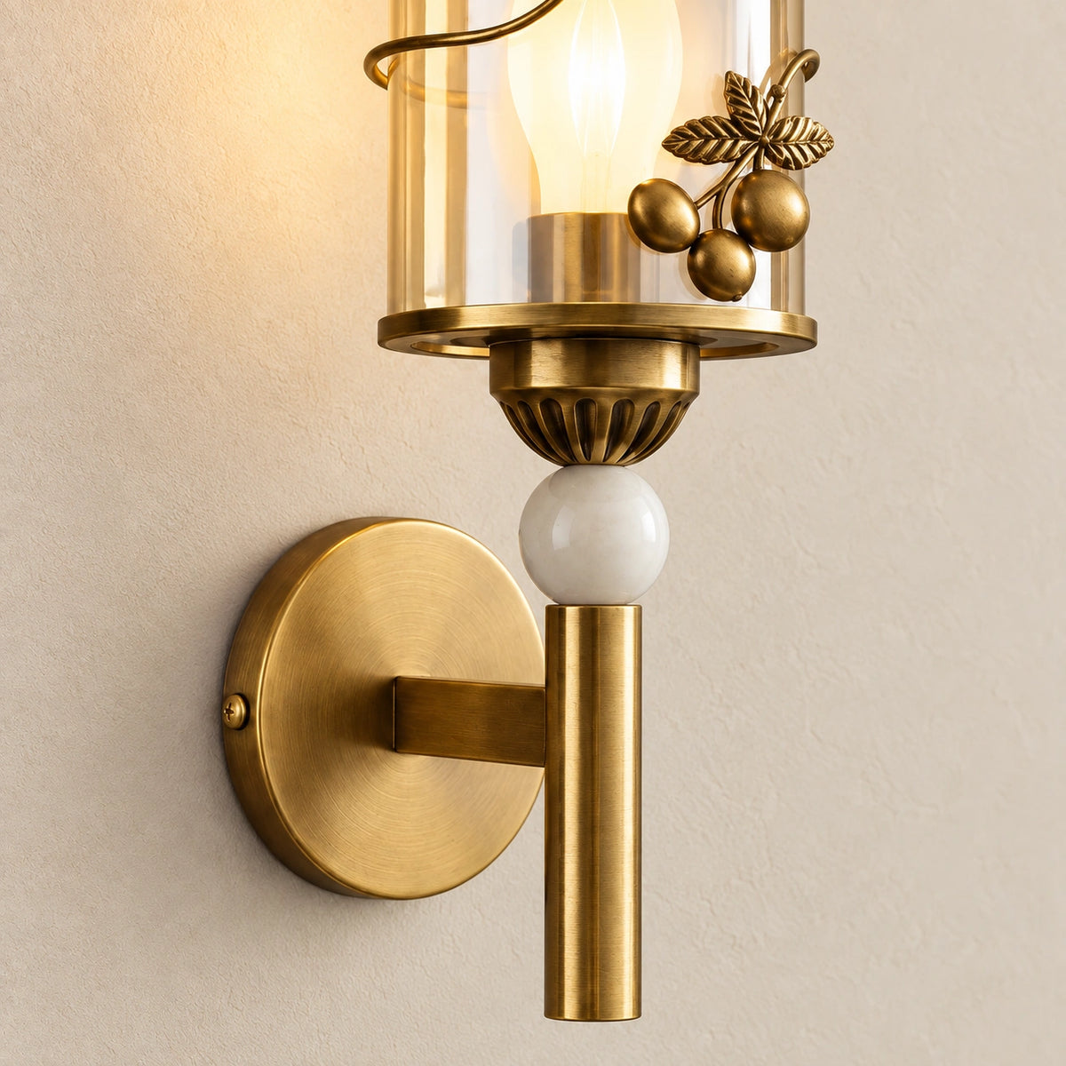 Close-up of the botanical shade, pale sphere, arm connection and backplate fixing