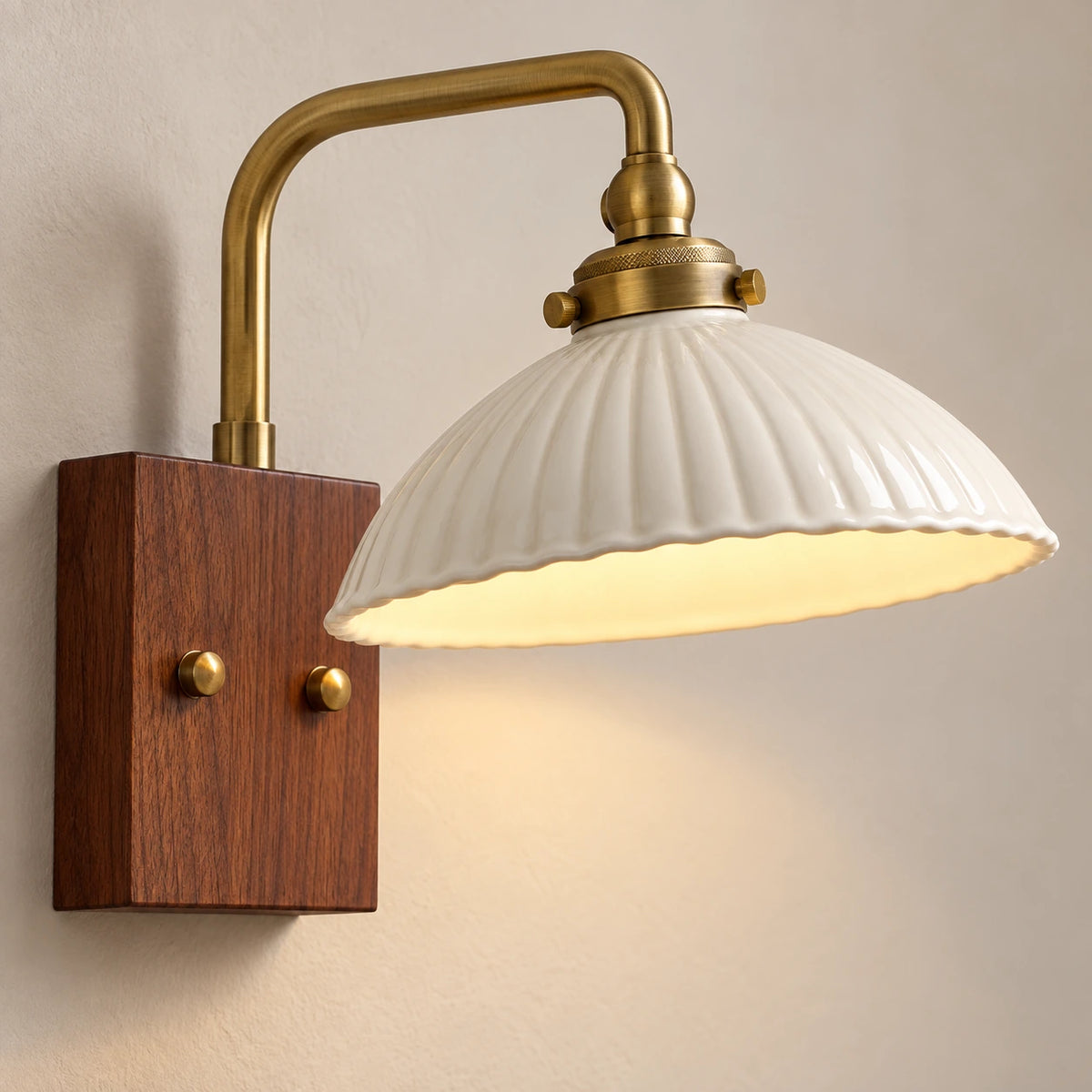 Close-up of the ribbed ceramic shade, brass-tone collar and two backplate fixings