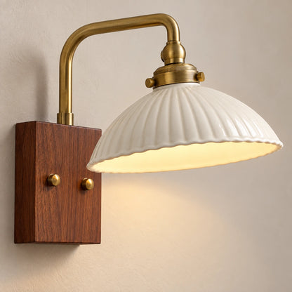 Close-up of the ribbed ceramic shade, brass-tone collar and two backplate fixings