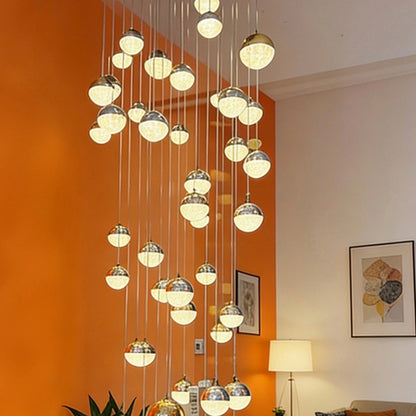 Close-up of individually suspended illuminated globes
