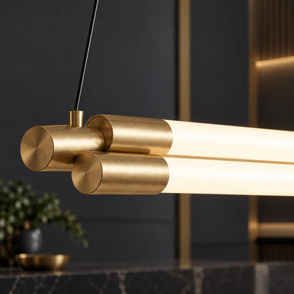 Close-up of twin luminous tubes and staggered gold-tone end caps