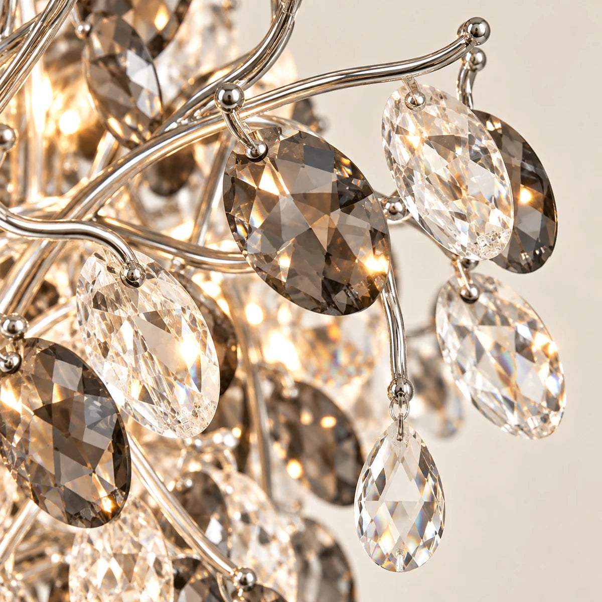 Close-up of clear and smoke crystal leaves on silver branches