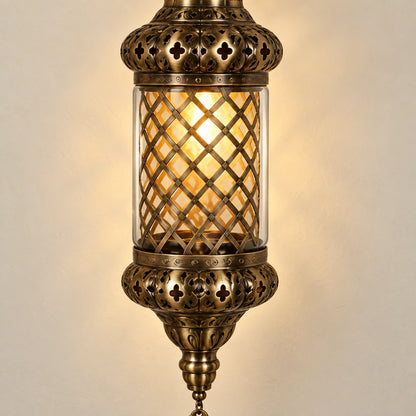 Close-up of the antique-brass lattice shade and clear outer glass