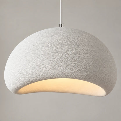 Close-up of textured dome surface and asymmetric illuminated opening
