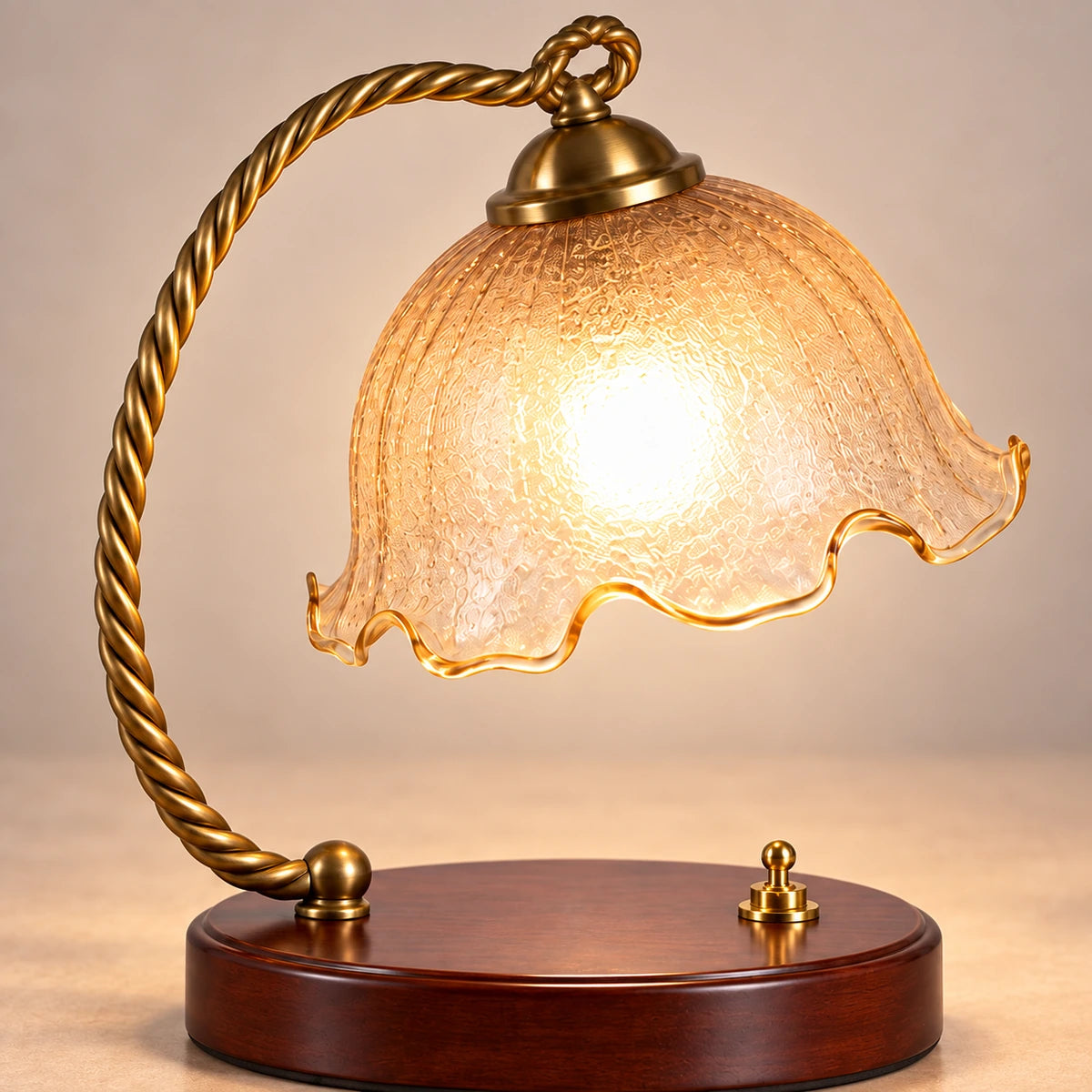 Close-up of the amber glass shade, twisted arm and wooden base