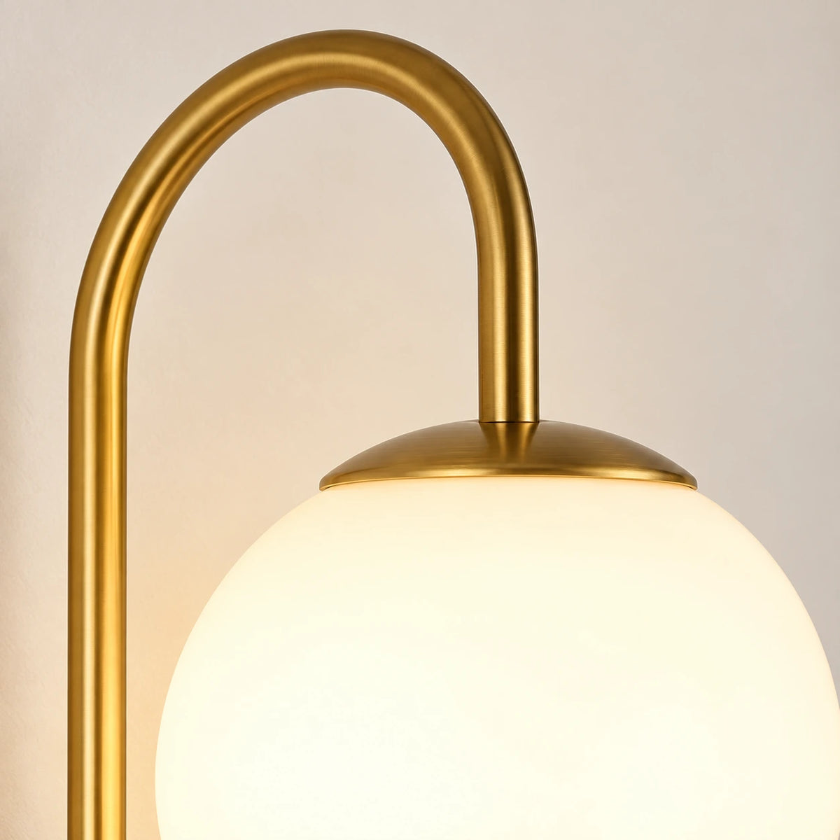 Close-up of the opal globe, gold cap and arched connector