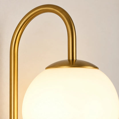 Close-up of the opal globe, gold cap and arched connector