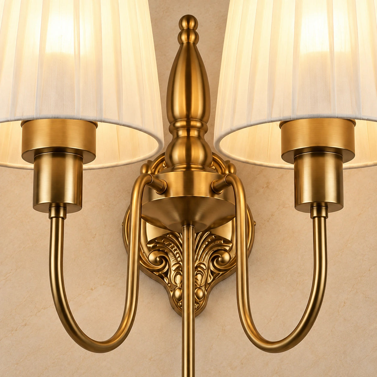 Close-up of the pleated shades, antique-gold arms and ornate centre frame