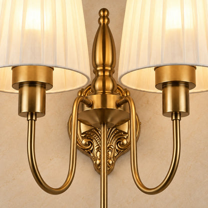 Close-up of the pleated shades, antique-gold arms and ornate centre frame