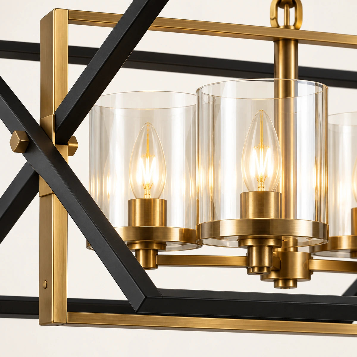 Close-up of black angular rails, antique-gold frame, clear glass and lamp holders