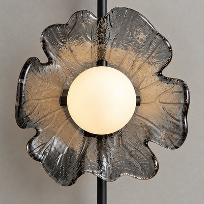 Close-up of the illuminated globe and textured flower-shaped plate