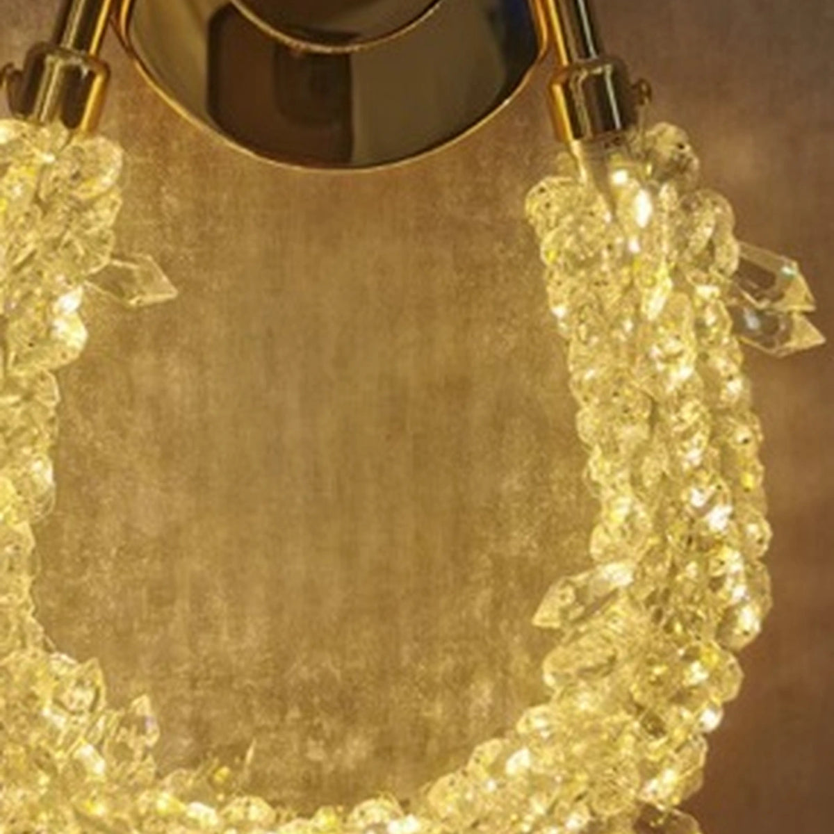 Close-up of the gold connector and clear faceted loop