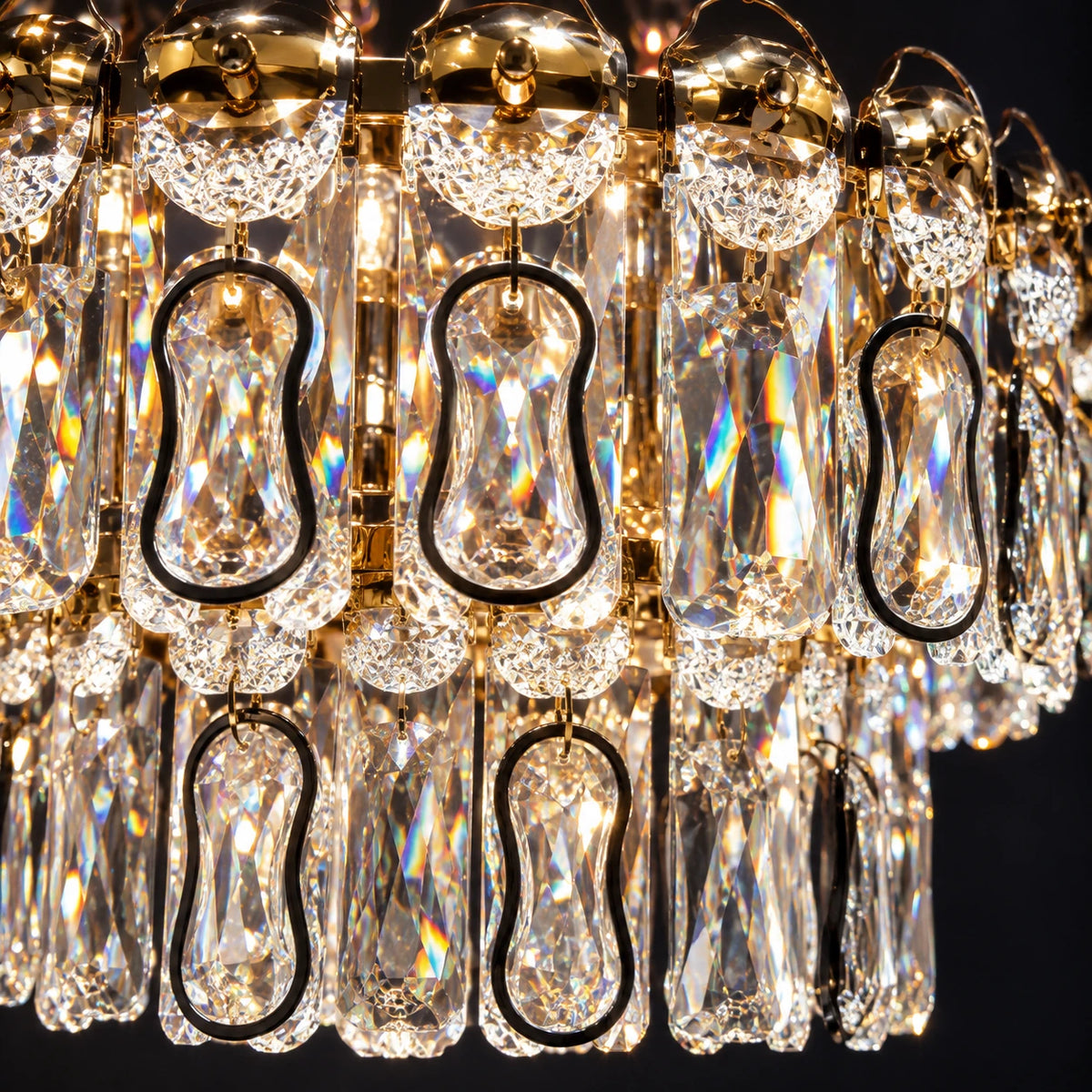 Close-up of clear faceted drops and dark loop details