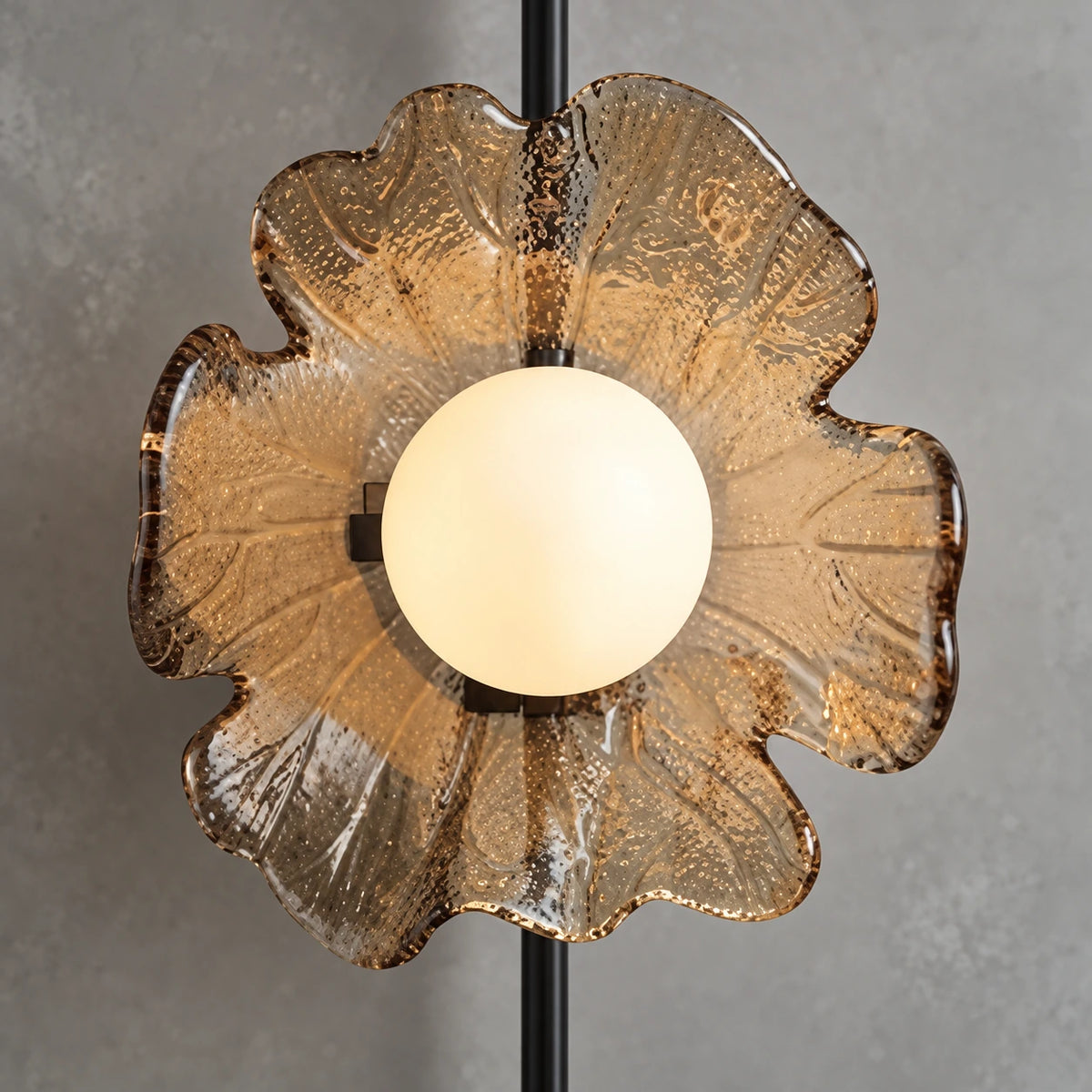 Close-up of the warm globe and textured translucent amber petal detail