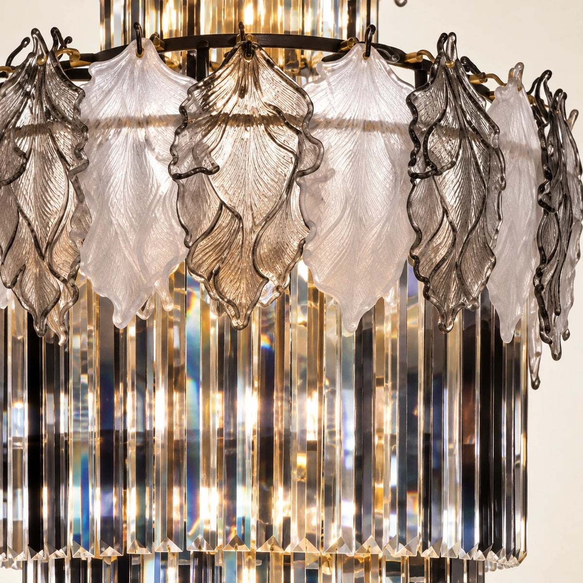 Close-up of the white and smoke glass leaves above alternating crystal prisms