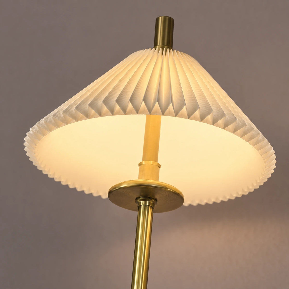 Close-up of the pleated shade, scalloped edge and antique-gold support detail