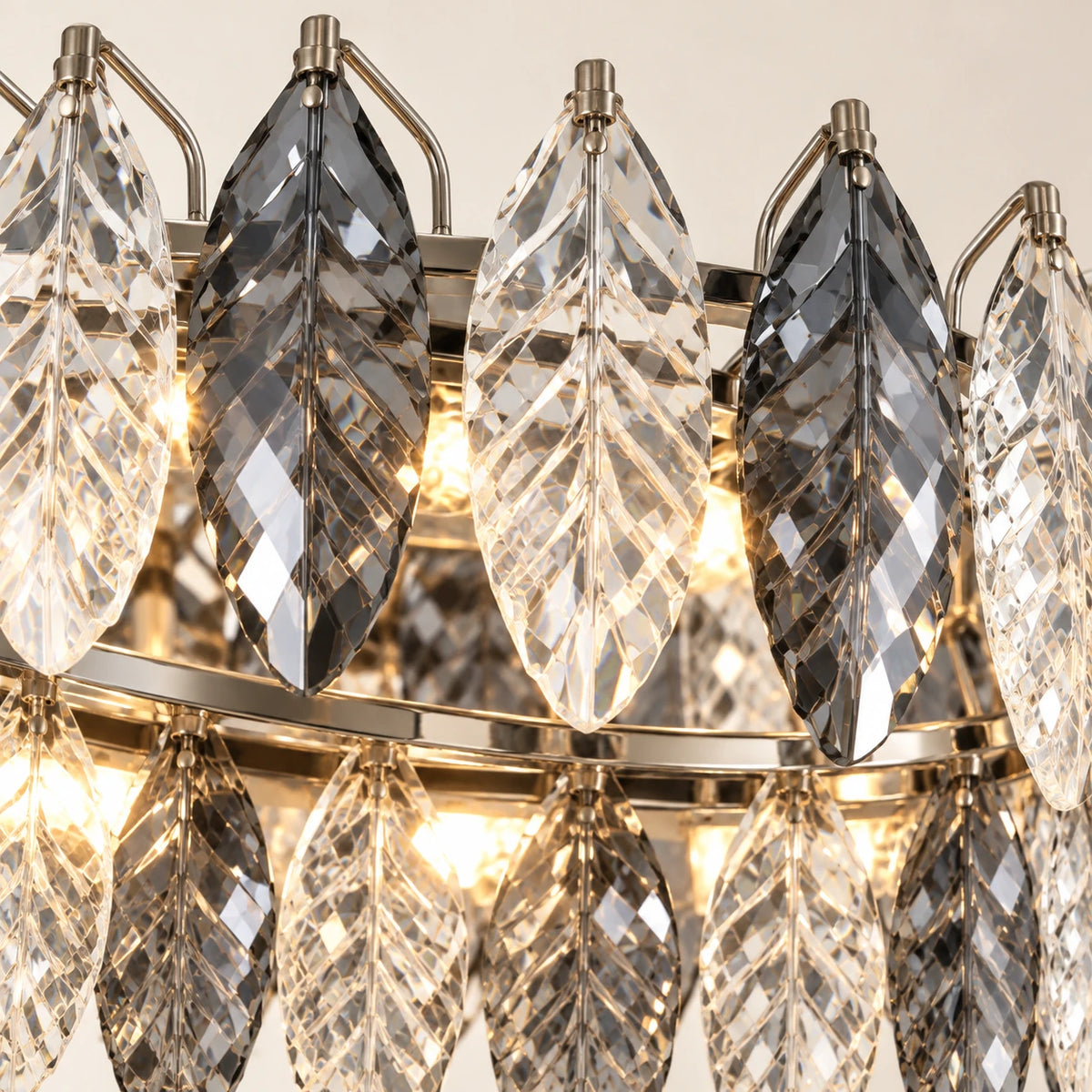 Close-up of the alternating clear and smoke crystal leaves and oval metal frame