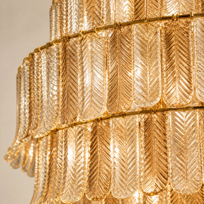 Close-up of the tiered ribbed glass elements and gold-toned support rings