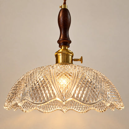 Close-up of diamond-cut glass scalloped edge and wood-metal connection