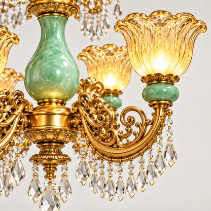 Close-up of green glass, scalloped shade, ornate arm and crystal drops