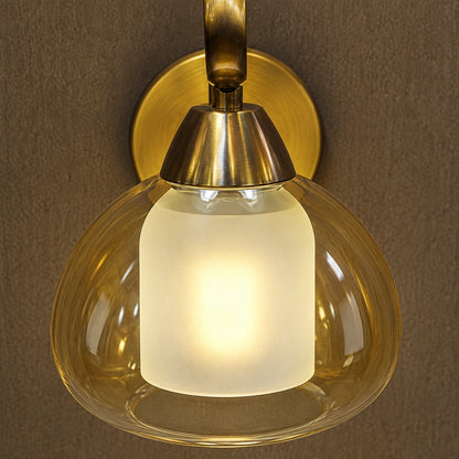 Close-up of amber outer glass, frosted inner diffuser and antique-brass connection