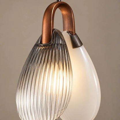 Close-up of the copper loop and overlapping ribbed and milky glass shells