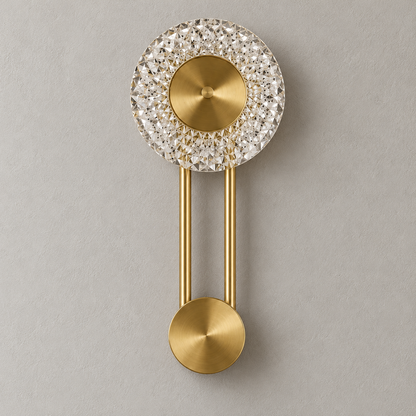Close-up of the Celestine wall light's faceted crystal halo, brushed-gold centre, twin rods and lower disc