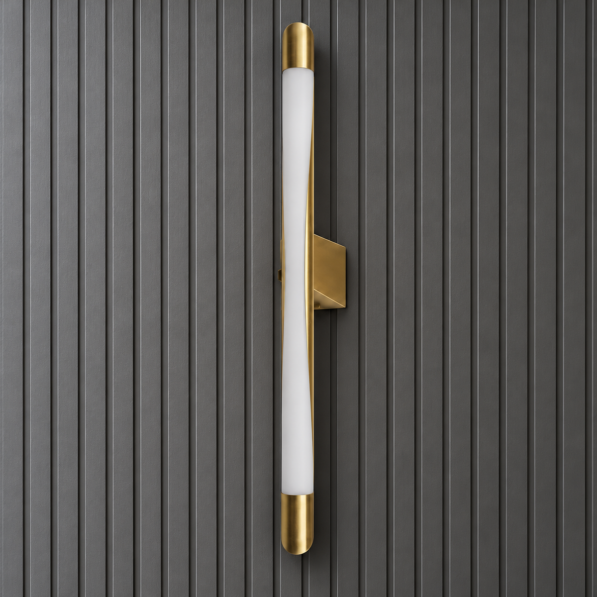 Close-up of the Serein wall light's curved white diffuser, gold end caps and angular wall bracket