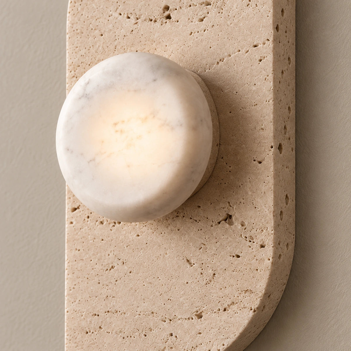 Dune stone globe and travertine plate — illustrative detail; natural texture varies