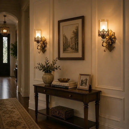 Pair of Antique Fleur glass wall sconces in an entrance