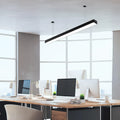 Sleek linear LED pendant above office desks