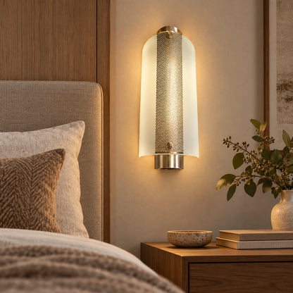 Frosted-glass wall light beside a bed