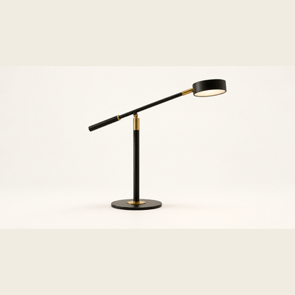 Axis black and gold task table lamp on a clean neutral studio background