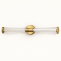 Elara brushed-gold twin-tube LED mirror light on a warm ivory studio background