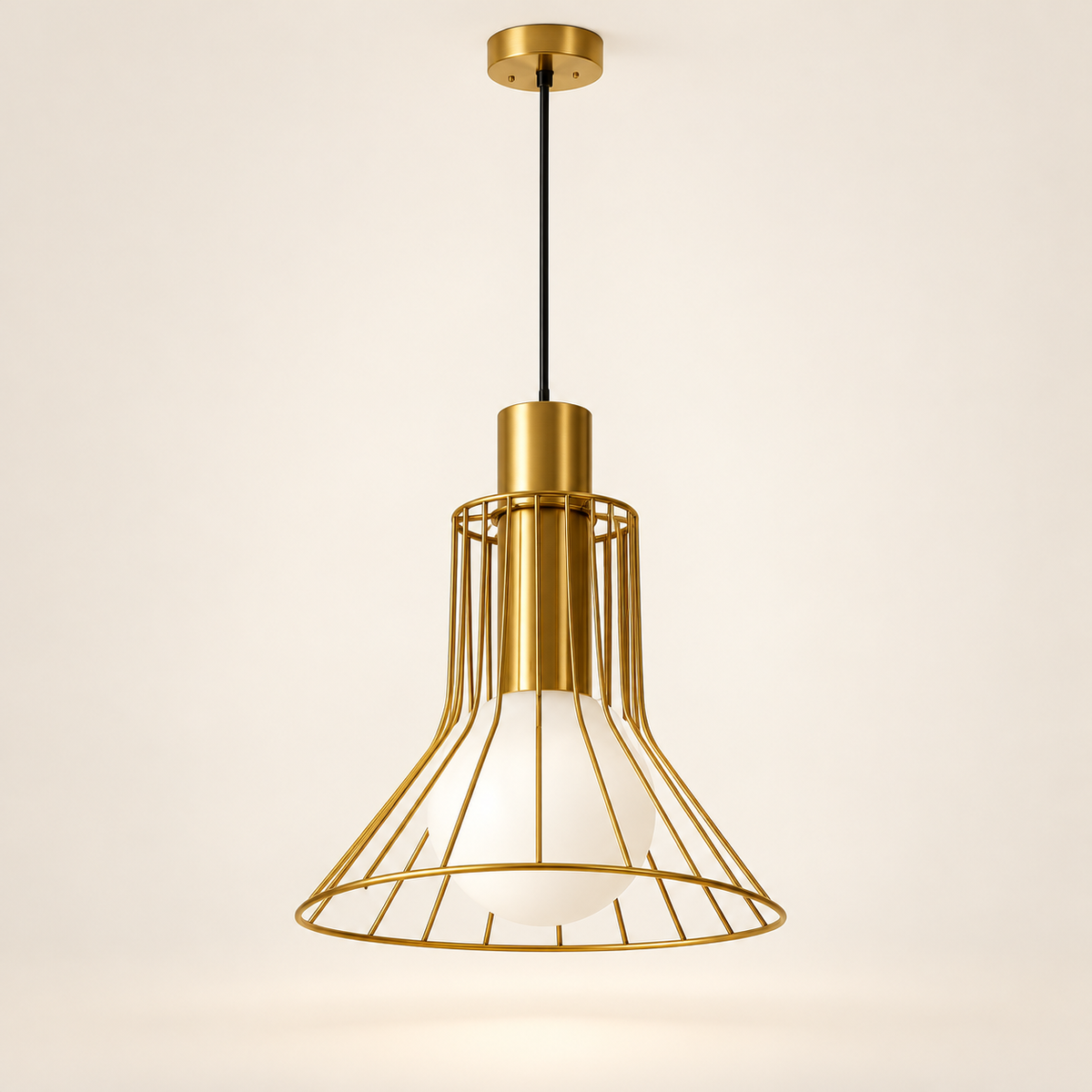 Solenne gold wire LED pendant light on a warm studio background